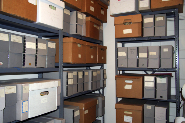 Metal shelves containing archival and file boxes.
