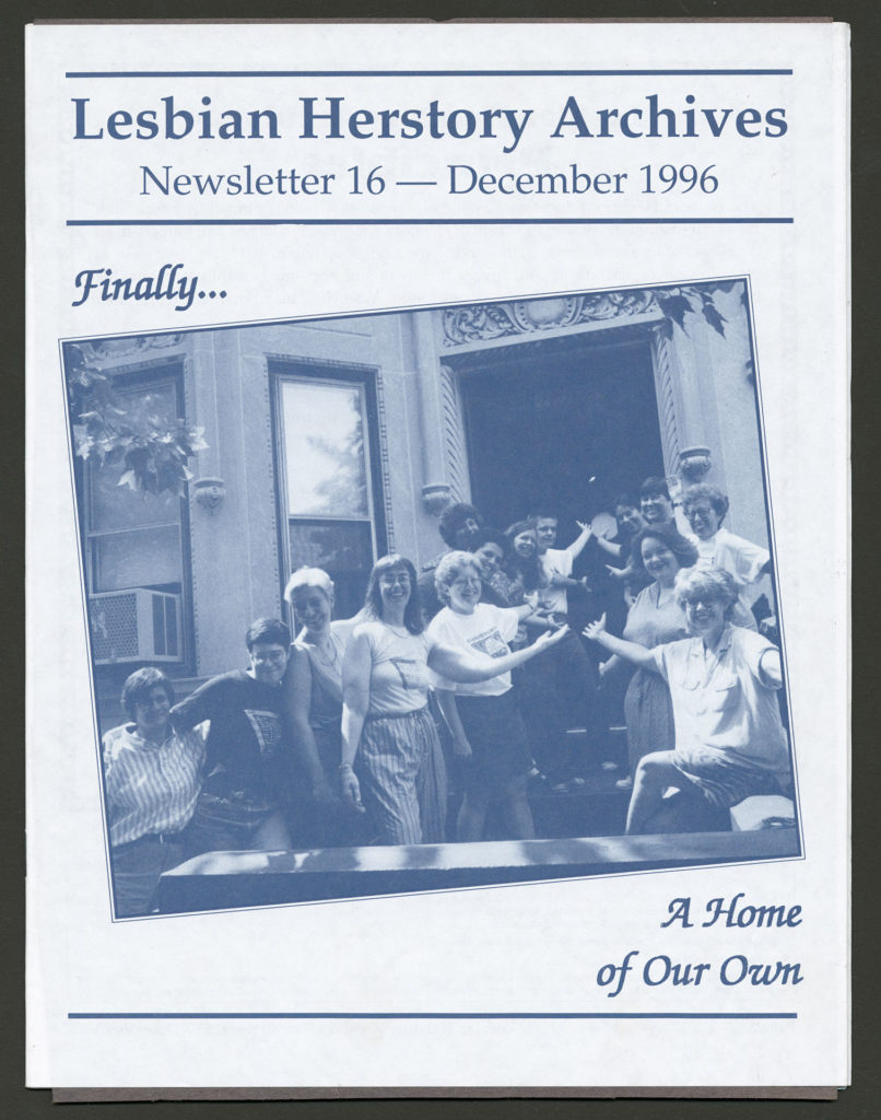 The front of a newsletter dated December 1996. The photo on the cover is of a group of smiling Lesbians gesturing toward the door of the LHA building. The caption reads "Finally...A Home of Our Own."